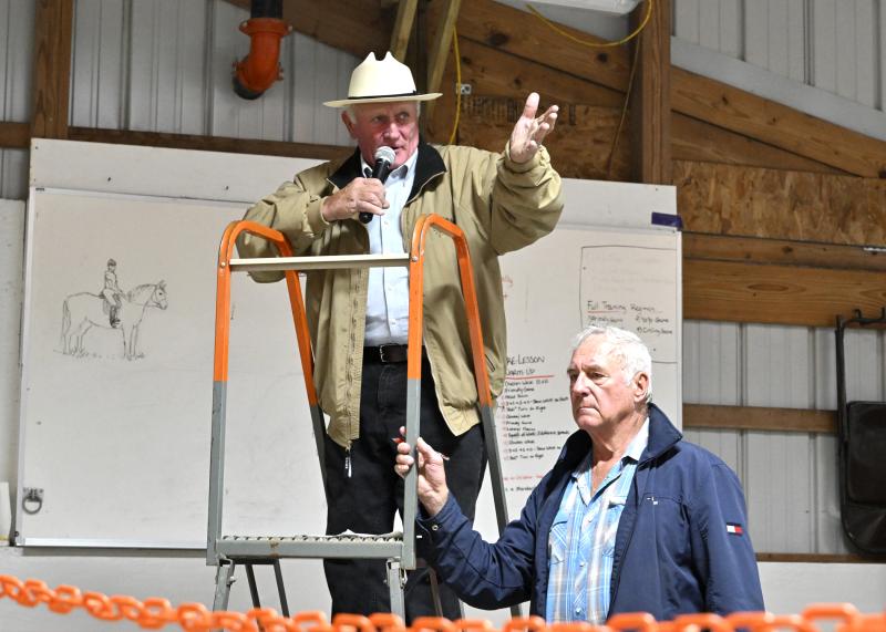 Sen. Dave Wilson serves as the auctioneer and emcee of the Parade of Horses auction. In front is Stan Vonasek.