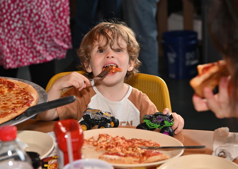 Teddy Whibley, 3, enjoys the pizza at the event. Monster trucks and Nicola Pizza, it doesn’t get any better than that.