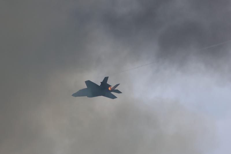 Capt. Melanie Kluesner in the F-35A passes through smoke created by pyrotechnics set off during her display.