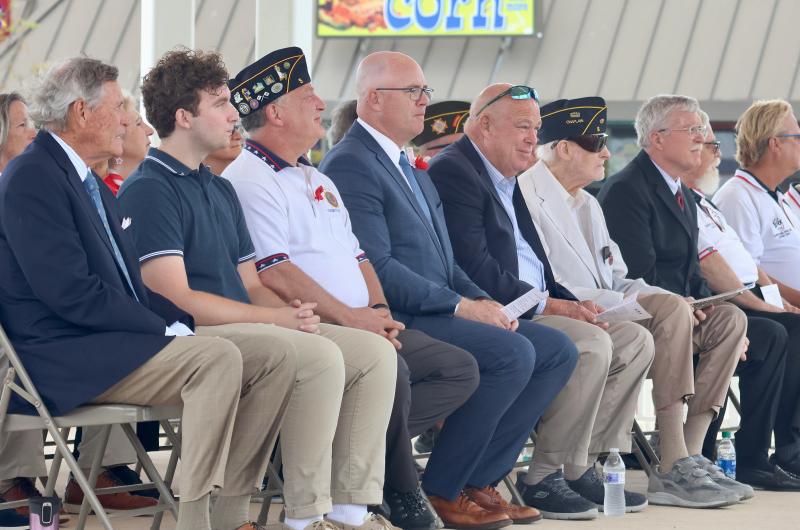 People who came to participate in the ceremony at the Bandstand include (l-r) retired Cmdr. John Burke, U.S. Navy; Aaron Webster, musician; Ron Webster, Post 5 adjutant; Sen. Russ Huxtable D-Lewes; Rep. Pete Schwartzkopf, D-Rehoboth Beach; Greg Gause, Post 5 chaplain; and Stan Mills, mayor of Rehoboth Beach.