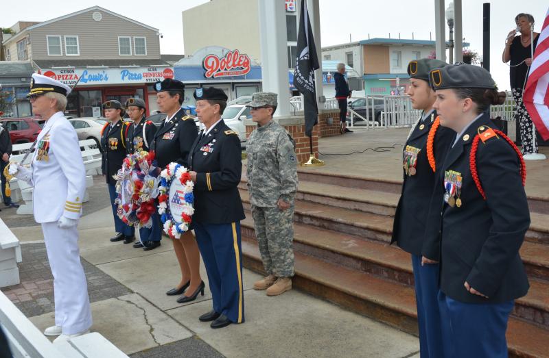 Gay Women of Rehoboth Beach hosted its inaugural Memorial Day ceremony in 2023. Shown are (l-) retired Commander Jeanette Shimkus, Cape Henlopen High School JROTC Cadet Gianna Decker, CHHS JROTC Cadet Jazmine Ramos-Trejos, retired Col. Lisa Weidenbush, retired Col. Deborah Knickerbocker, retired Master Sgt. Tama Viola, CHHS JROTC Cadet Ninfa Cantu and CHHS JROTC Cadet Abbey Schaeffer. CHRIS FLOOD PHOTO