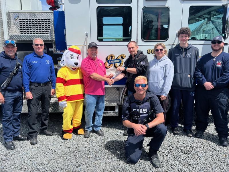 The Dewey Beach Lion's Club presented the Rehoboth Beach Volunteer Fire Company with a $5,000 donation. The fire company is extremely thankful to the Lion’s Club for its generous donation, said Deputy Chief Kent Swarts. Gathered are (l-r) fire policeman Karl Hornberger, Swarts, Sparky the Fire Dog, Scott Joseph, firefighter Charlie Marshall, EMT Cory Ciekot, fire company associate Mary Rossettini, firefighter Todd Warwick, and EMT Mike Moore in front. SUBMITTED PHOTO