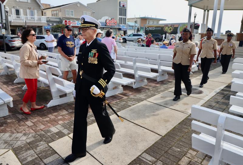 Retired Cmdr. Dr. Jeanette Shimkus, U.S. Navy, leads members of the Seaford High School Navy JROTC to the wreath-laying ceremony.