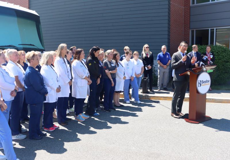 Dr. David Tam, Beebe president and CEO, speaks at a May 1 press conference to address a community alert over a surge in overdose cases in Sussex County. Beebe has treated 30 cases in the last week, significantly more than usual. Tam is backed by Beebe doctors, nurses, staff and Beebe’s Behavioral Health Mobile Unit, which helps provide Narcan kits to the community. BILL SHULL PHOTO