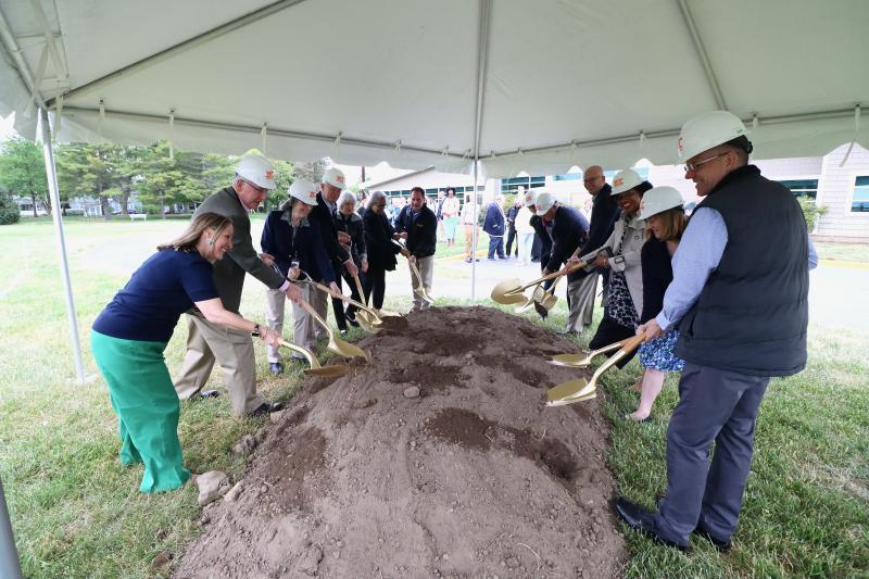 Lewes Public Library broke ground on its new $1.75 million outdoor pavilion May 3. Shown are (l-r) Jill DiPaolo, library director;
Tom Schmidt, board member; Nancy Sakaduski, board member;
Ted Becker, board member; Leslie Newman, board member; Rep. Stell Parker Selby, D-Milton; Sussex County Councilman Mark Schaeffer; Andrea Brock, development committee; Hugh Leahy, trustee emeritus; Sen. Russ Huxtable, D-Lewes; Chanta Wilkinson, president, board of commissioners; Maureen Miller, vice president, board of commissioners; and Tom Thunstrom, board member. BILL SHULL PHOTO