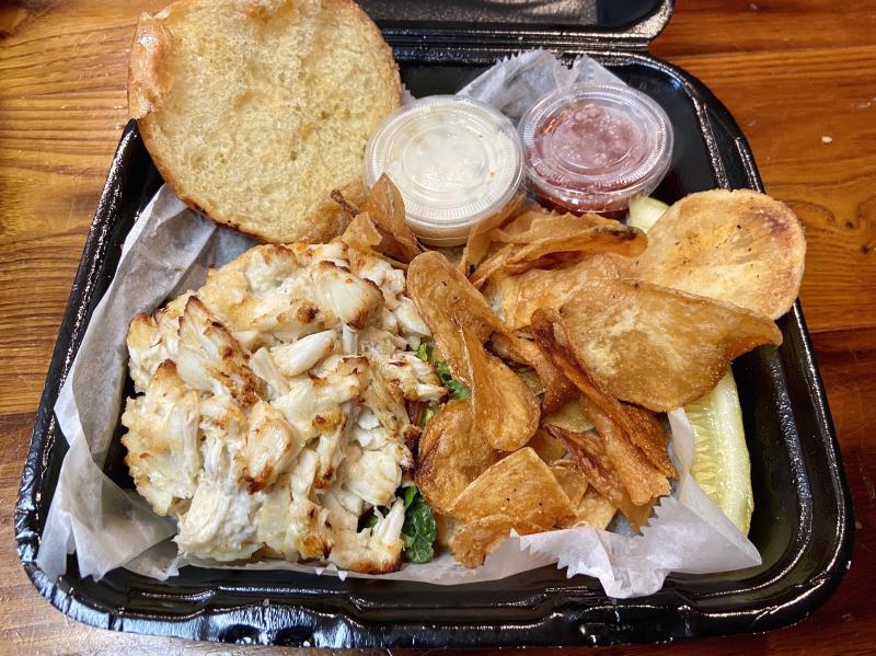 In addition to cooked and take-and-bake crab cakes, patrons can order from a mostly full menu; burgers and steaks won’t be available, as the location doesn’t have an open-flame grill. ELLEN DRISCOLL PHOTO