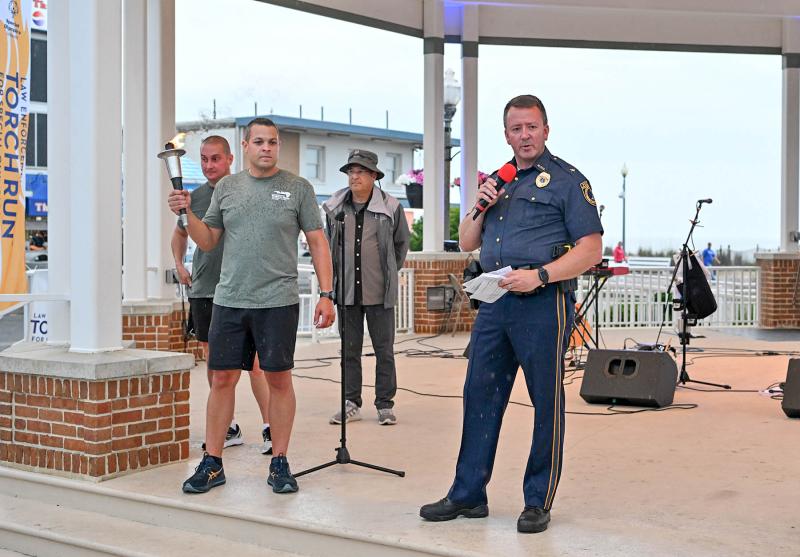 Chief Bill Texter of the Middletown Police Department speaks about the Torch Run. Shown are (l-) Master Cpl. Dana Wyant of Rehoboth Beach PD, Master Cpl. Ryan Albert of the Delaware State Police, Steve Monz from Rock 107.7 and Texter.