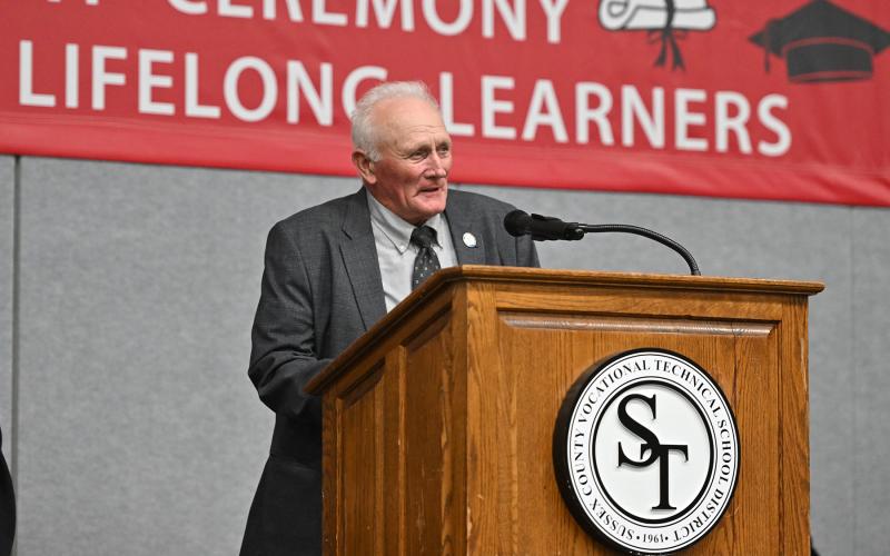 Sen. Dave Wilson, R-Lincoln, addresses the graduates as he presents a tribute from the Delaware Senate.