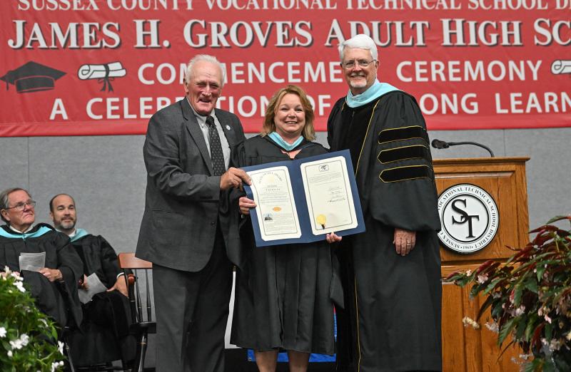 Sen. Dave Wilson, R-Lincoln, presents a tribute from the Delaware Senate to Kelly Whaley, director of adult education; and Sussex County Vocational Technical School District Superintendent Kevin Carson.