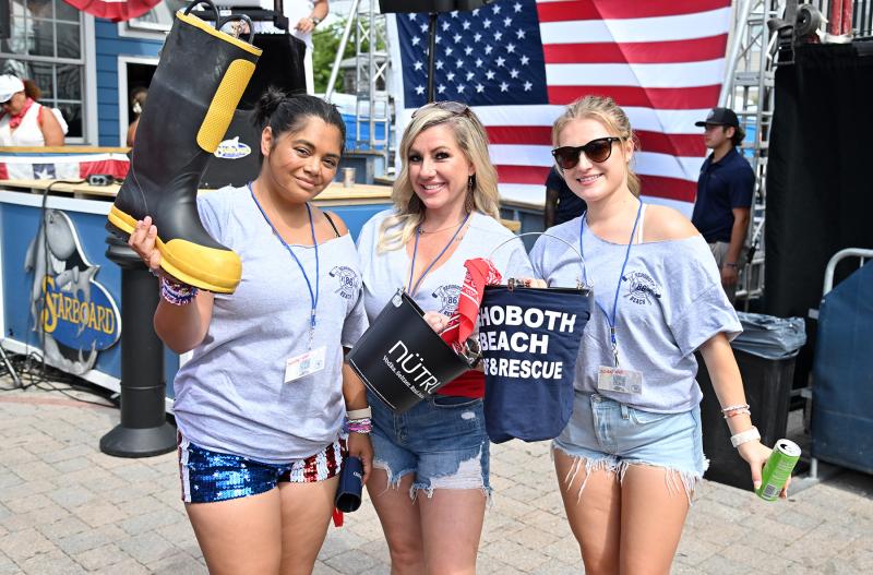 Collecting donations for the Rehoboth Beach Volunteer Fire Company are (l-r) Anna Edmondson, Olivia McDonnell and Zoe Peters.