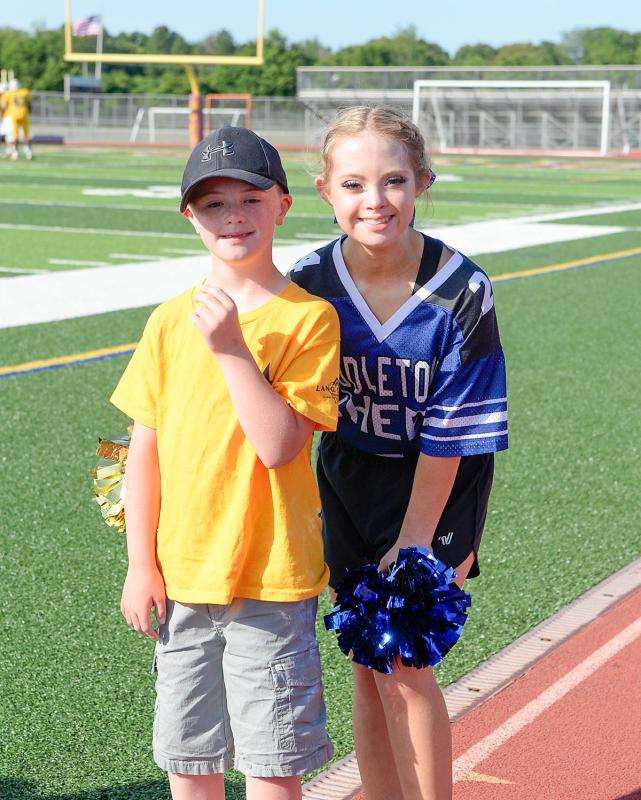 Garrett Boyles, left, stands with his cheerleader friend Kayla Kosmalski of Middletown. Kosmalski, 17, is breaking barriers and making history as the first contestant with Down syndrome to be crowned Miss Delaware Teen USA.