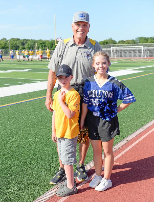 Tony Glenn, DFRC senior advisor to the board of trustees, stands with Garrett Boyles and Kayla Kosmalski.