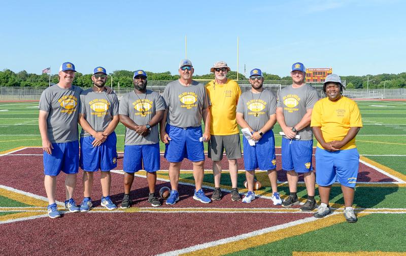 Coaching the Gold squad are (l-r) JD Messeck and Brandon Dooley of Woodbridge, Eston Ennis of Sussex Tech, Marvin Dooley of Woodbridge, team manager Nick Tiberi, Dom Trotta of Woodbridge, Pat Moffit of St. Andrews and team manager Terrance Walker.