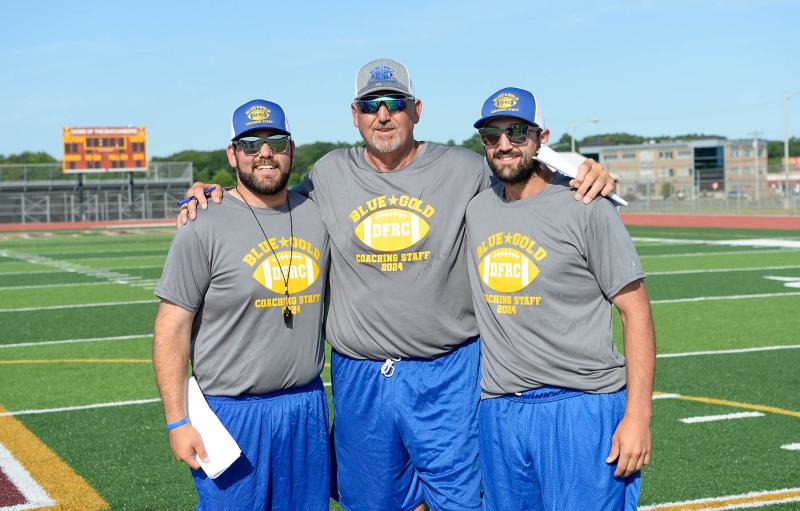 Coaching the Gold squad is a family affair. Woodbridge head coach Marvin Dooley, center, coaches the Gold team with his sons Dom Trotta, left, and Brandon Dooley.