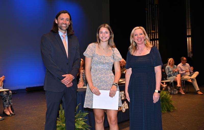 Ashlyn Andrew is presented with the Liberty University Academic Scholarship and the President's Award for Educational Excellence.
Presenting the awards are Cape Assistant Principal Joshua Chubb and Principal Kristin DeGregory.