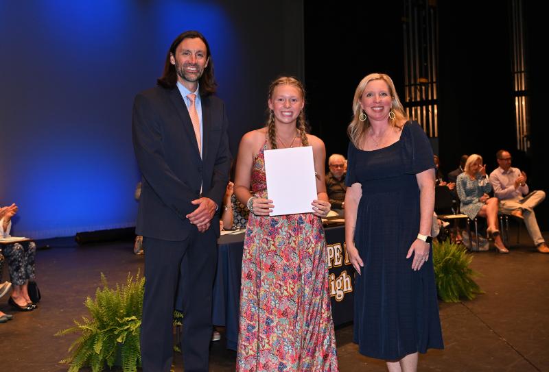 Mackenzie Burns is presented with the Coastal Carolina Provost Scholarship, the Coastal Carolina University Scholars Award and the President's Award for Educational Excellence. Presenting the awards are Cape Assistant Principal Joshua Chubb and Principal Kristin DeGregory.