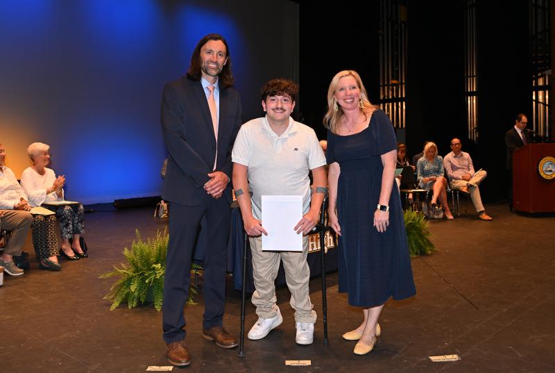 Brandon Impagliazzo receives the F.H & L.O. Russell Scholarship and the UD Delaware Scholar Award. Presenting the awards are Cape Assistant Principal Joshua Cubb and Principal Kristin DeGregory.