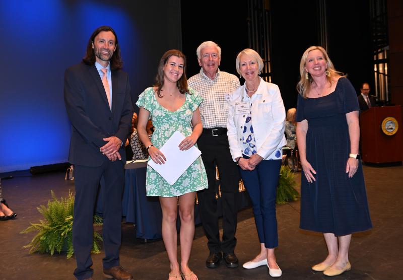 Anna Kucharik receives the Lewes in Bloom Scholarship, President's Award for Educational Excellence and the UD Presidential Scholarship. Shown are (l-r) Cape Assistant Principal Joshua Cubb, Kucharik, Lewes in Bloom’s John Roecker and Dianne Stevens and Cape Principal Kristin DeGregory.