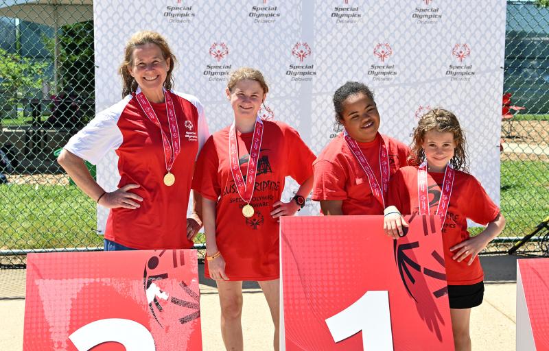 The unified swim team shows its winning attitude. Shown are (l-r) Lori Smyth, Katelyn Taylor, Gabby Parillon and Clara Gallagher.