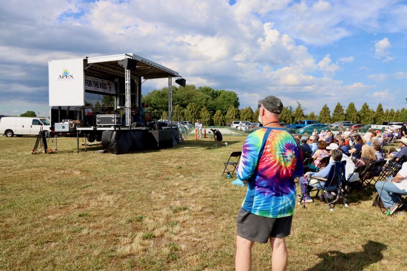 Joe Rogers of Long Neck is into the rock ‘n’ roll and tie-dye as he listens to Melody Trucks & the Fitzkee Brothers perform at the Paul Kares concert.