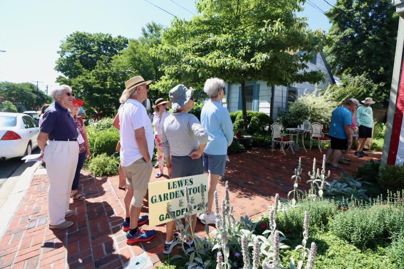 There were lines at most of the seven stops on the garden tour. These curious garden tourers were waiting to check out stop No. 2 on W. Third Street.