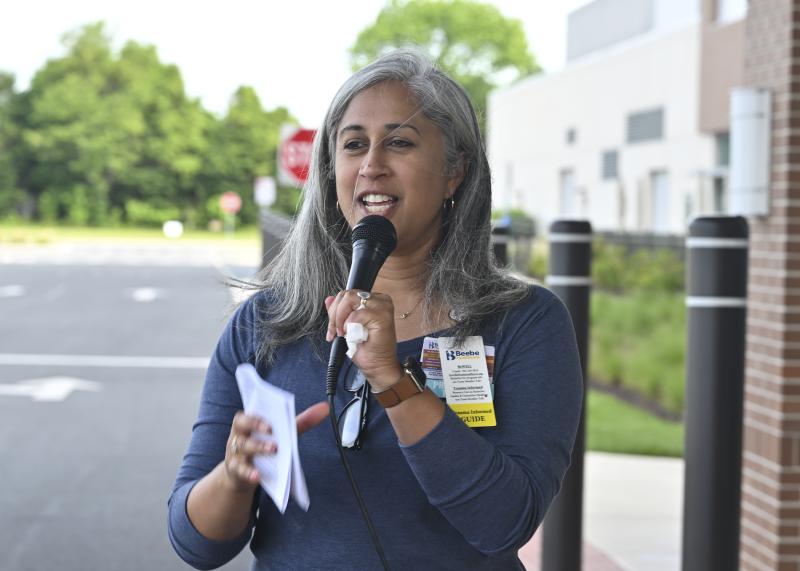 Rita Williams, manager of psycho-social services for Beebe oncology, welcomes everyone to the Miracle Mile event.
