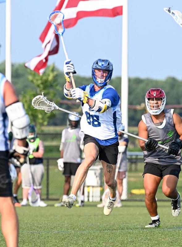 Former Cape player and Shorebreak middie Hunter Jones goes airborne to take a shot on the Flaming Windows goal.