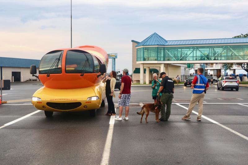 The Wienermobile draws a crowd of people who want a picture with the iconic vehicle, even a DRBA K-9 got a look.