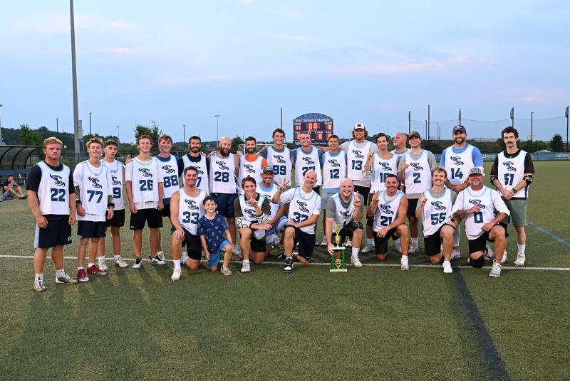 Players of the undefeated Shorebreak Lacrosse team get together after their 11-8 victory over the Riptide. Shown in back are (l-r) CJ Fritchman, Cody Trivits, Michael Guenther, Luke Burton, Hunter Jones, Hank Coveleski, Dave Mushrush, Max Coveleski, Nick Arnold, Mason Griffith, Joe Coveleski, Jack Dennis, Andrew Scrutchfield, Brian Micciche, Landon Best, Dan Yearick and Quinn Stewart. In front are Blake Woodruff, manager Clark Burress, Blake Gipko, Neil Little, Nick Scroggs, Franc Cook, Ben Todd, Reece Stone and Kyle Griffith. DAN COOK PHOTOS