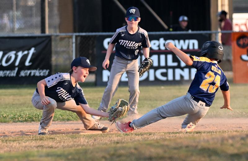 Milton shortstop Hudson Hartstein goes for the tag on Nanticoke’s Luke Willin but the runner is called safe.