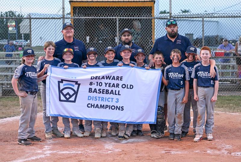 The Milton all-stars pose with the District 3 banner. Shown in back are (l-r) coach Andy Hartstein, manager Mike Nelson and coach Jordan Reynolds. In front are Krew Johnson, Nole Beam, Jacob Reynolds, Dominic Nelson, Jaxon Kulp, Hudson Hartstein, Easton Goodwin, Bryce DeLacy, Wyatt Dean, Owen Croce and Ronan Lotter.