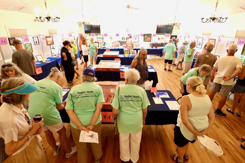 A silent auction is held inside the parish hall. Organizer Jeff Whipple said 90% of the vendors donated to the auction this year. The indoor location also gave people welcome relief from the heat.