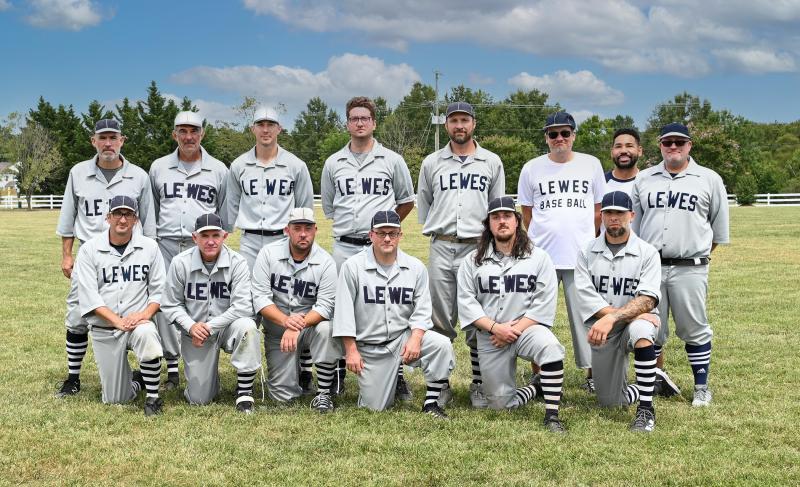 The Lewes Baseball Club comprises in back (l-r) Mike “Bones” Dowd, Ed “Chief” Rush, Joe “Milwaukee” Vilkoski, Sal “Potter” Mortorano, Kevin “Dart” Schultz, Gary Hartford, Willy Rojas and Eric “Big Poppa” Watland. In front are Mike “Oyster” DiPaolo, Mark “Zap” Evans, Mike “Chicken” Curry, John “Squirrel” Kennedy, Chris “Lovey” Chapdelaine and Steve “Wheels” Shane. DAN COOK PHOTOS