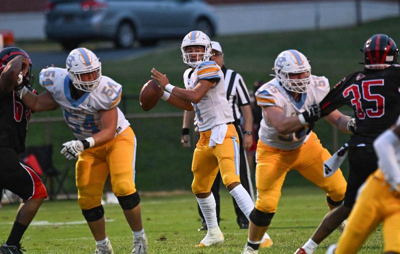 Cape quarterback Jameson Tingle has ample time in the pocket thanks to the blocking of David Schulze, left, and Bodie Frederick.