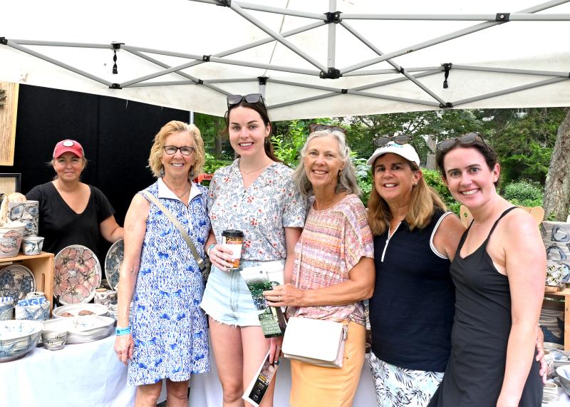 Browsing in front are (l-r) Carol Thomson, Amy Thomson, Megan Reardon, Jennifer Sullivan and Corinne Sullivan, all from Wilmington. Lisa Chambers of Delaware Bay Clay is in back.