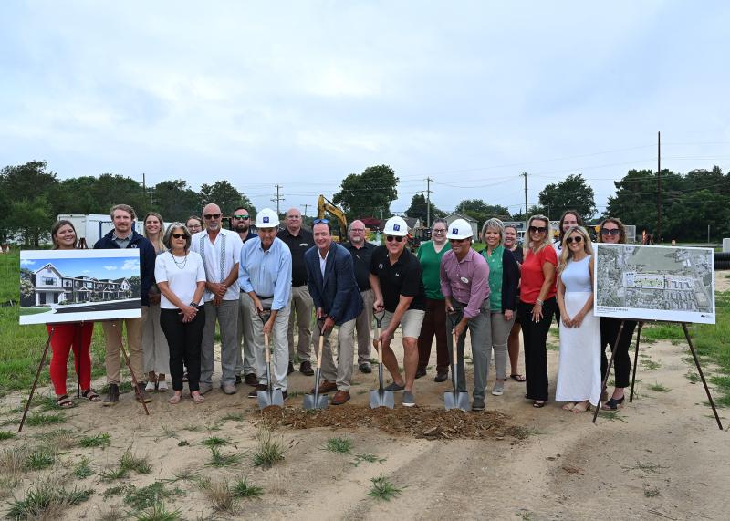 Participants in the Dutchman’s Harvest groundbreaking are (l-r) Holly Millard, Ocean Atlantic Companies administrative assistant; Michael McNamee, OA project manager; Chelsea Bristow, Jack Lingo Realtor agent; Janet Reeves, Lewes assistant city manager; Katie O’Neal, OA accounting; Greg Tobias, OA executive manager; Ben Gordy, OA senior project manager; Greg Stevens, Lewes Attainable Housing LLC; Steve Hentschel, The Whayland Company president; Tom Tipton, OA chief operating officer; John Russ, Whayland vice president of operations; Preston Schell, Lewes Attainable Housing LLC; Janelle Cornwell, Lewes planning and building manager; Khalil Saliba, Lewes deputy mayor; Ellen Lorraine McCabe, Lewes city manager; Marissa Ferrell, Dutchman’s Harvest prospective buyer; Jaime Zolper, OA senior project manager; Jackson Wayne, OA analyst; Alexis Gruber, Dutchman’s Harvest sales; and Jill Burton, OA executive assistant. TED PFIRRMANN PHOTOS