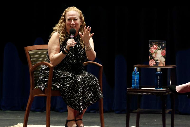 Author Jodi Picoult tells the sold-out crowd that her book is historical fiction that tells the all-too-real story of how women have had their voices silenced in the past and today. BILL SHULL PHOTO
