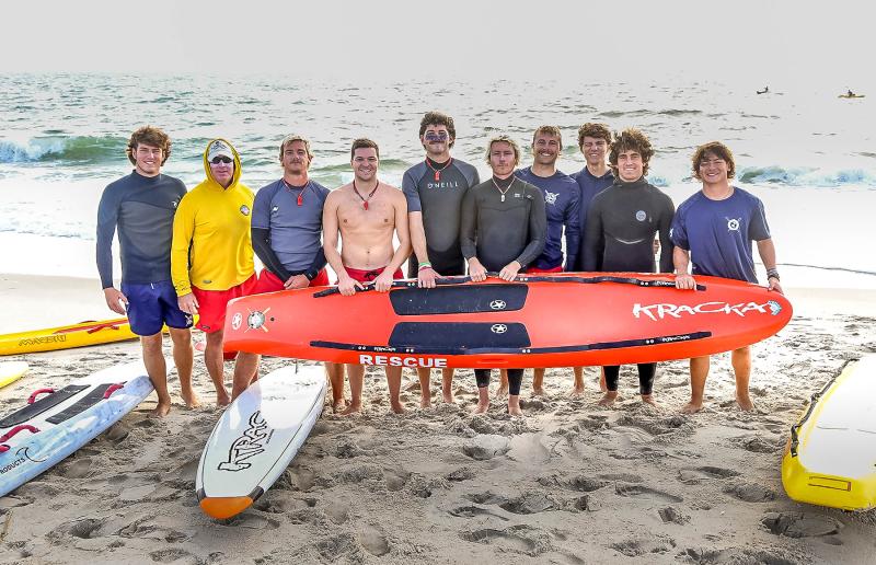 North Shores lifeguards assisted with the swim event. Shown are (l-r) Keller Mancari, Capt. Kent Buckson, RJ Senseny, Lt. Noah Houser, Bryce Tucci, Chief Augie Carlozzi, Quinn Buffington, Clay Peters, Miles Godwin and Ian Fonseca. Not pictured are Chief Aaron Tartal, Bob Bednarcick and Rob Witsil.