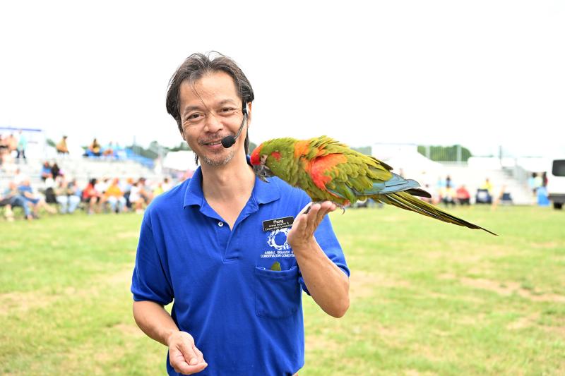 Luu Phung of the Animal Behavior & Conservation Connection gives a demonstration with his exotic birds.
