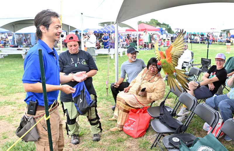 Luu Phung of the Animal Behavior & Conservation Connection gives a demonstration with his exotic birds.