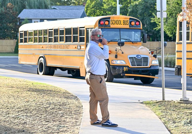 Frederick Thomas Middle School Principal David Frederick coordinates the bus arrival for the first day of school. DAN COOK PHOTO