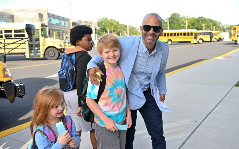 Lewes Elementary Vice Principal Alfredo Rodriguez welcomes Ben Rose and his sister Hattie. DAN COOK PHOTO