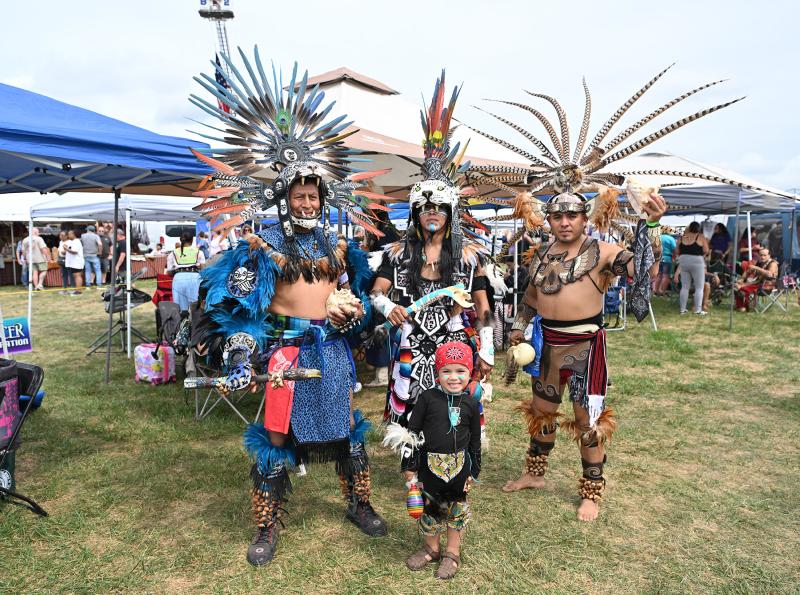 Displaying their intricate regalia are (l-r) Paulino Pedraza, Danny Osiro, Joseph Pina and Michael Dani, 3, in front.