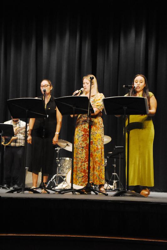 Choir teachers (l-r) Kait Colegrove, Juleean Schlitter and Marian Sunnergren sing during the performance of "Boogie Woogie Bugle Boy.”