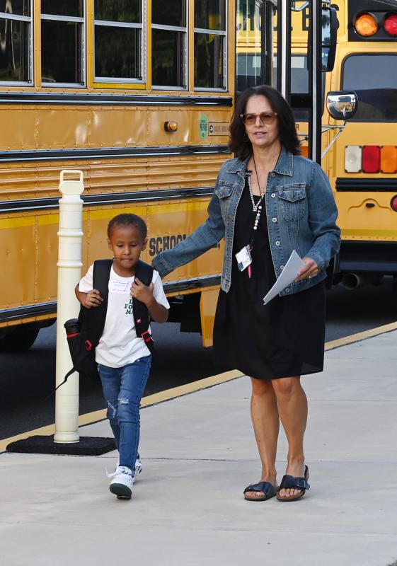 Christine Amalfitano walks kindergartener Gavyn Duncan to the door at Milton Elementary. NICK ROTH PHOTO