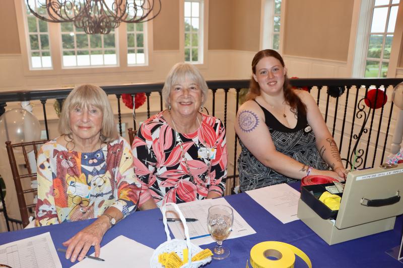 Welcoming people to the event are (l-r) HAP volunteers Carolee Botts, Nancy Van Dyke and Alyssa Zacco.
