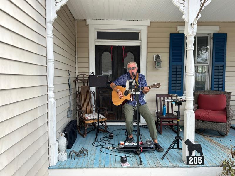 Al Frantic performs in front of 205 Union St. along the Milton Garden Tour. Each of the eight houses on the tour had an artist on site.