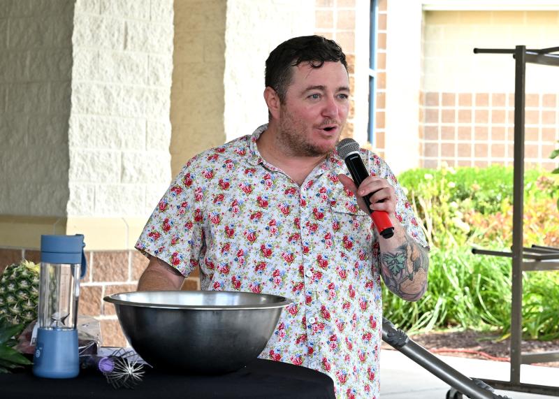 Chef Hari Cameron, a distinguished culinary consultant and celebrated chef, speaks to the enthusiastic crowd.