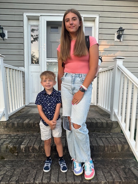 Cole McKenzie joins his sister, Mariner Middle seventh grader McKenzie Russell, for a first day of school photo.