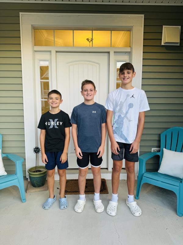 The Sender boys are eager to get the day started. Gathered are (l-r) Graham, fifth grade, Lewes Elementary; and Griffin, seventh grade, and Grayson, eighth grade at Frederick D. Thomas Middle. JANELLE SENDER PHOTO